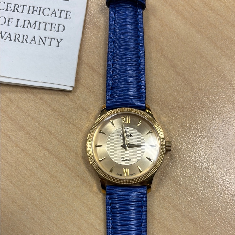18k Gold VicencE ladies watch with Royal Blue leather textured band. Gorgeous!